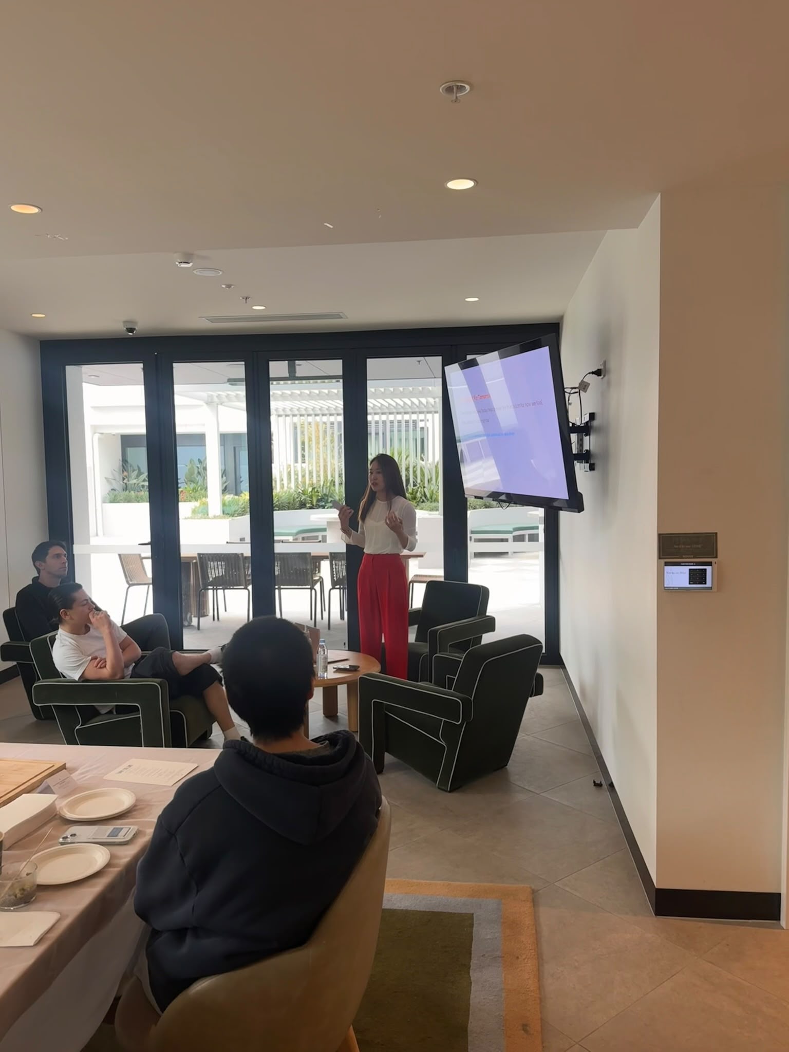 Jes presenting a nutrition workshop to a seated audience